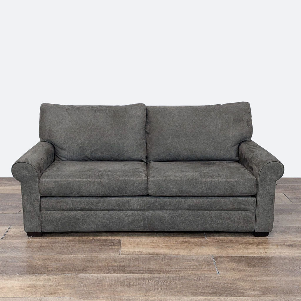 a black couch with a black leather seat 