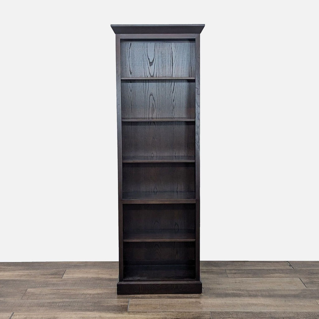 a wooden shelf with a black and white vase on top 