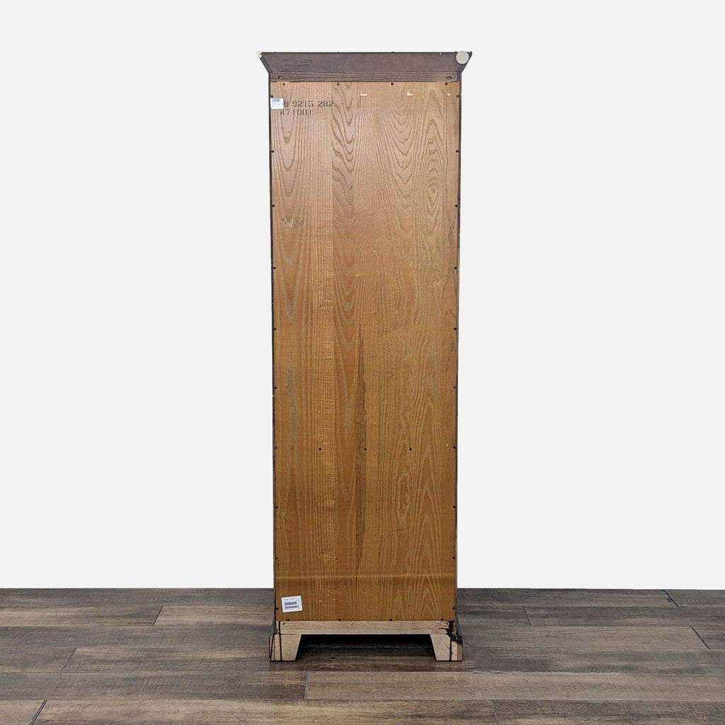 a wooden cabinet with a wooden trunk on top 