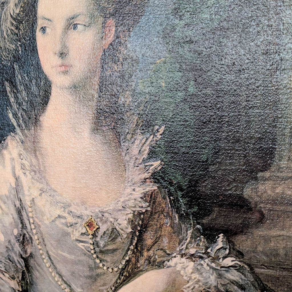 a woman in a black dress sitting on a white table 