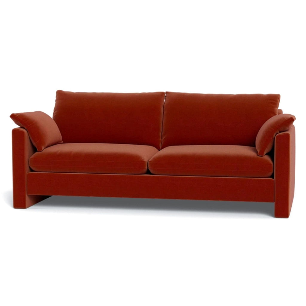 a red couch with a red couch cushions 