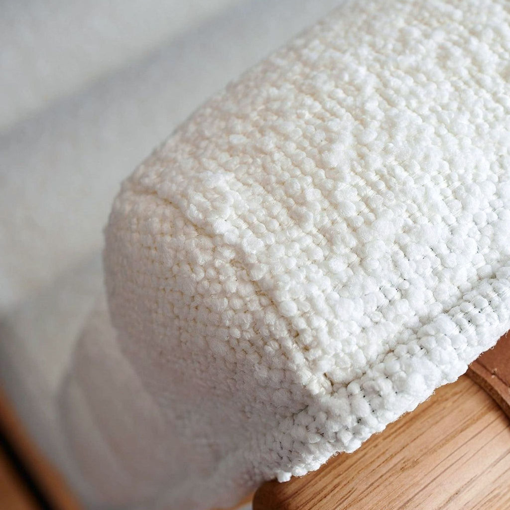 a white towel is laying on a white surface 