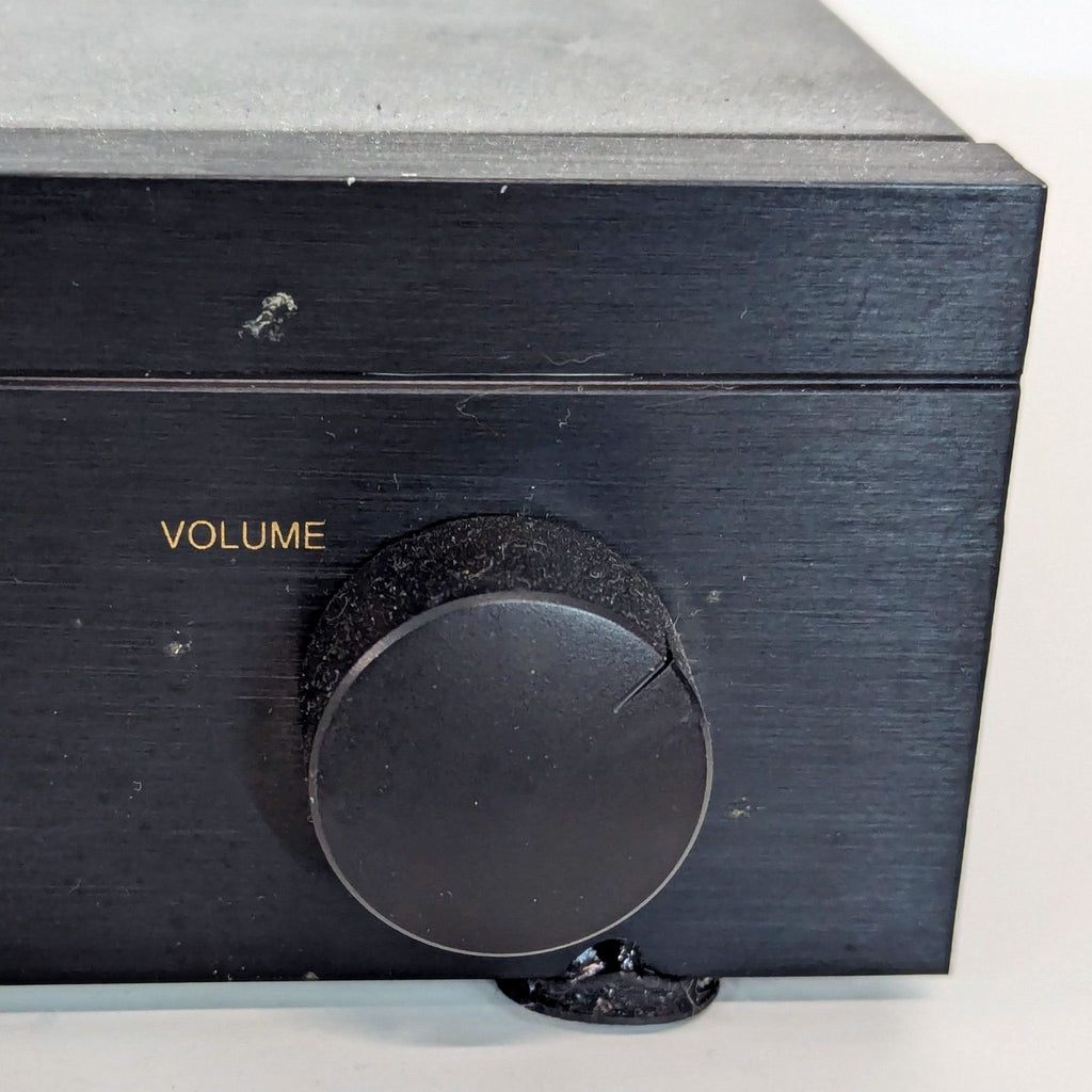 a small black and white toy gun on a table 