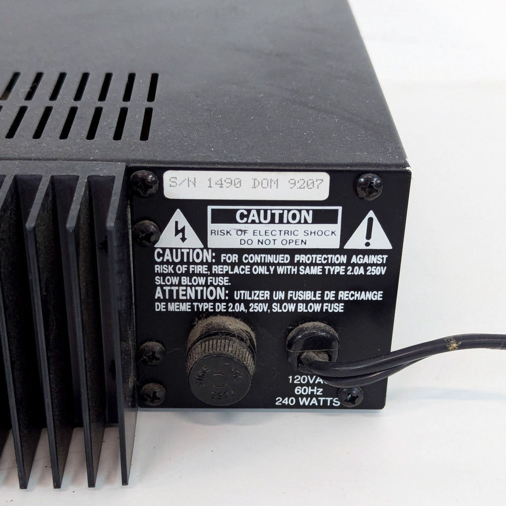 a black and white analog clock on a table 