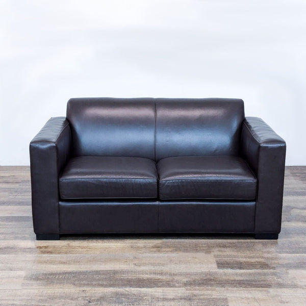 a black leather couch with a black leather seat 