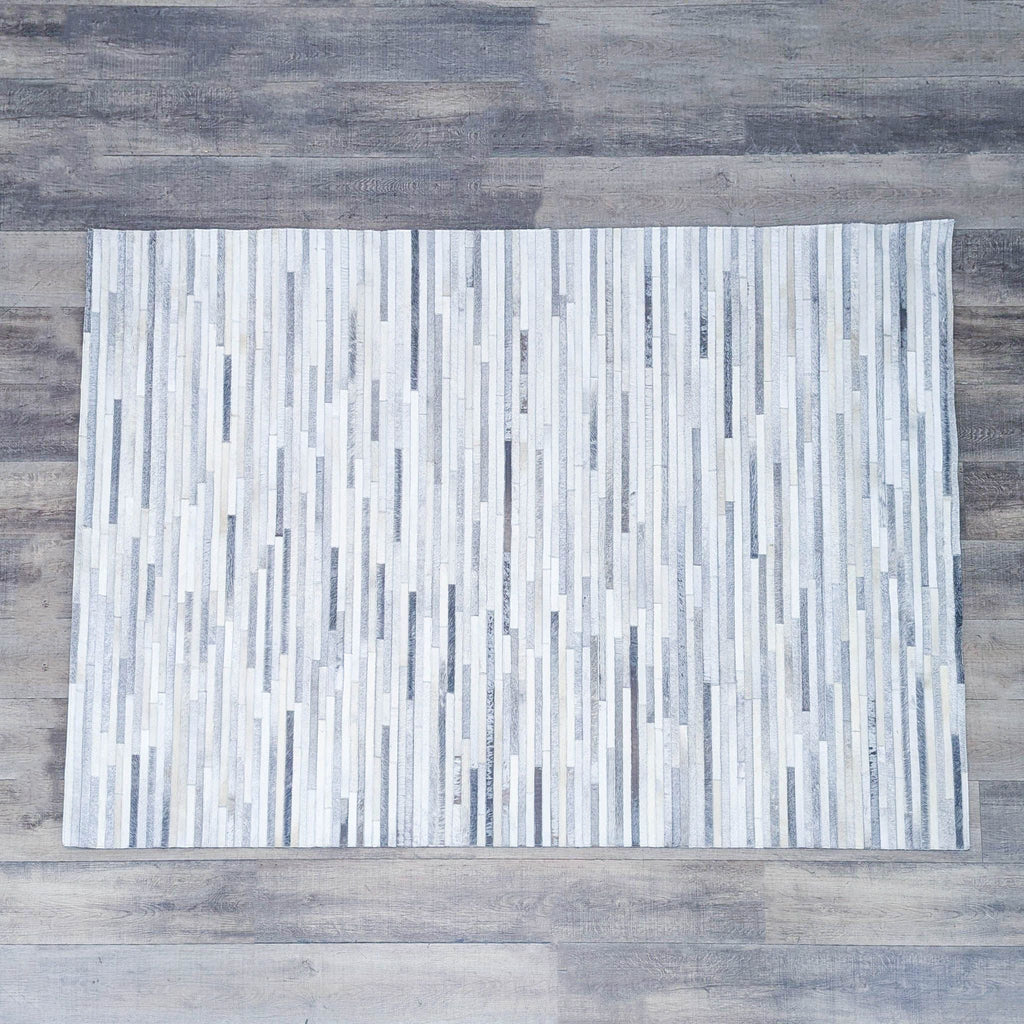 a white rug with a black and white pattern 