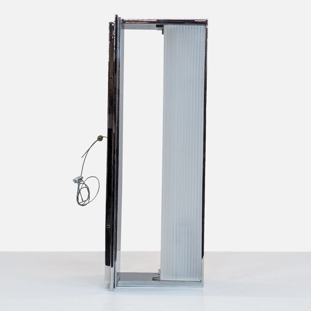 Modern chrome wall light with ribbed frosted glass shade, mounted on a sleek rectangular base.  