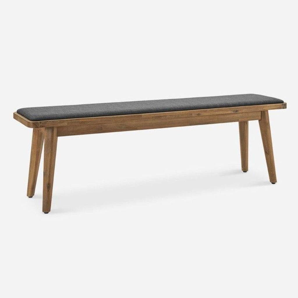a wooden bench sitting on top of a wooden floor 
