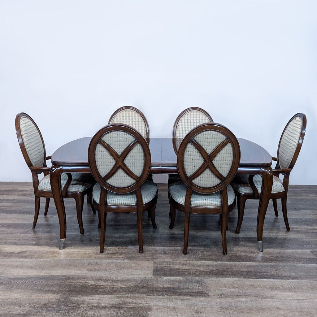 a table with chairs and a table cloth 