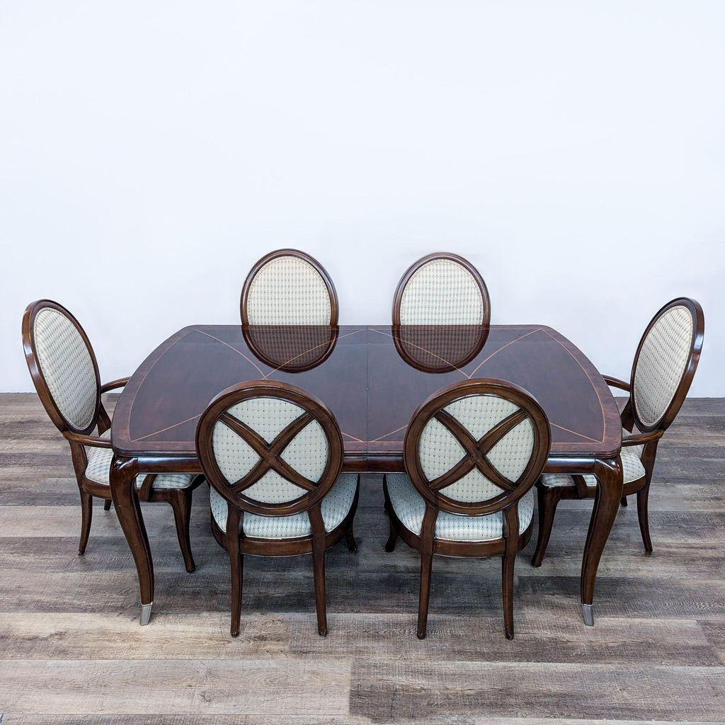 a table with chairs and a table cloth 