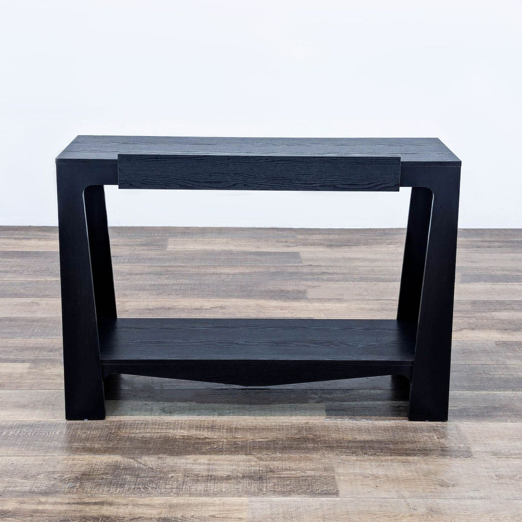 a wooden table with a wooden chair and a black and white vase 