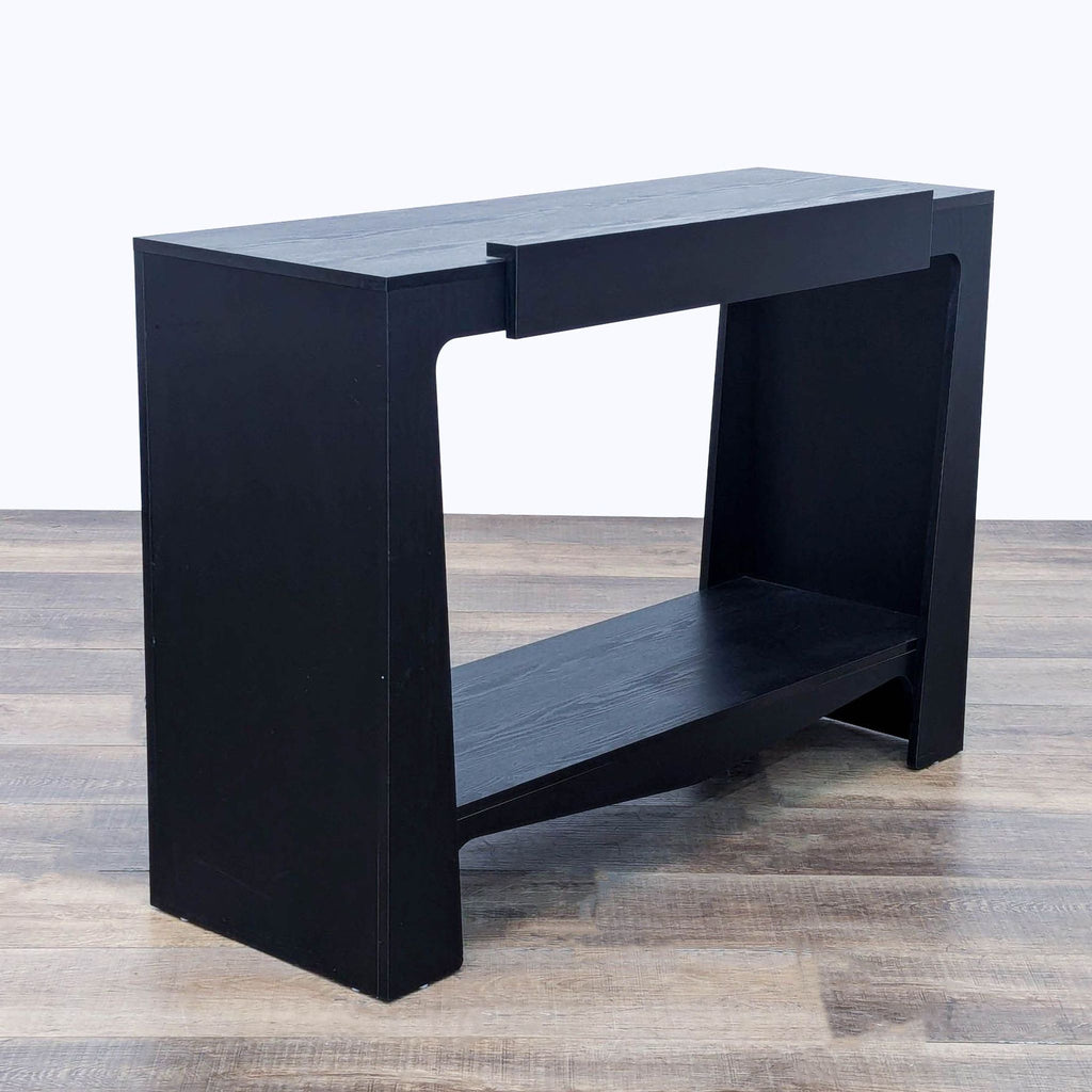 a wooden table with a black and white cover 