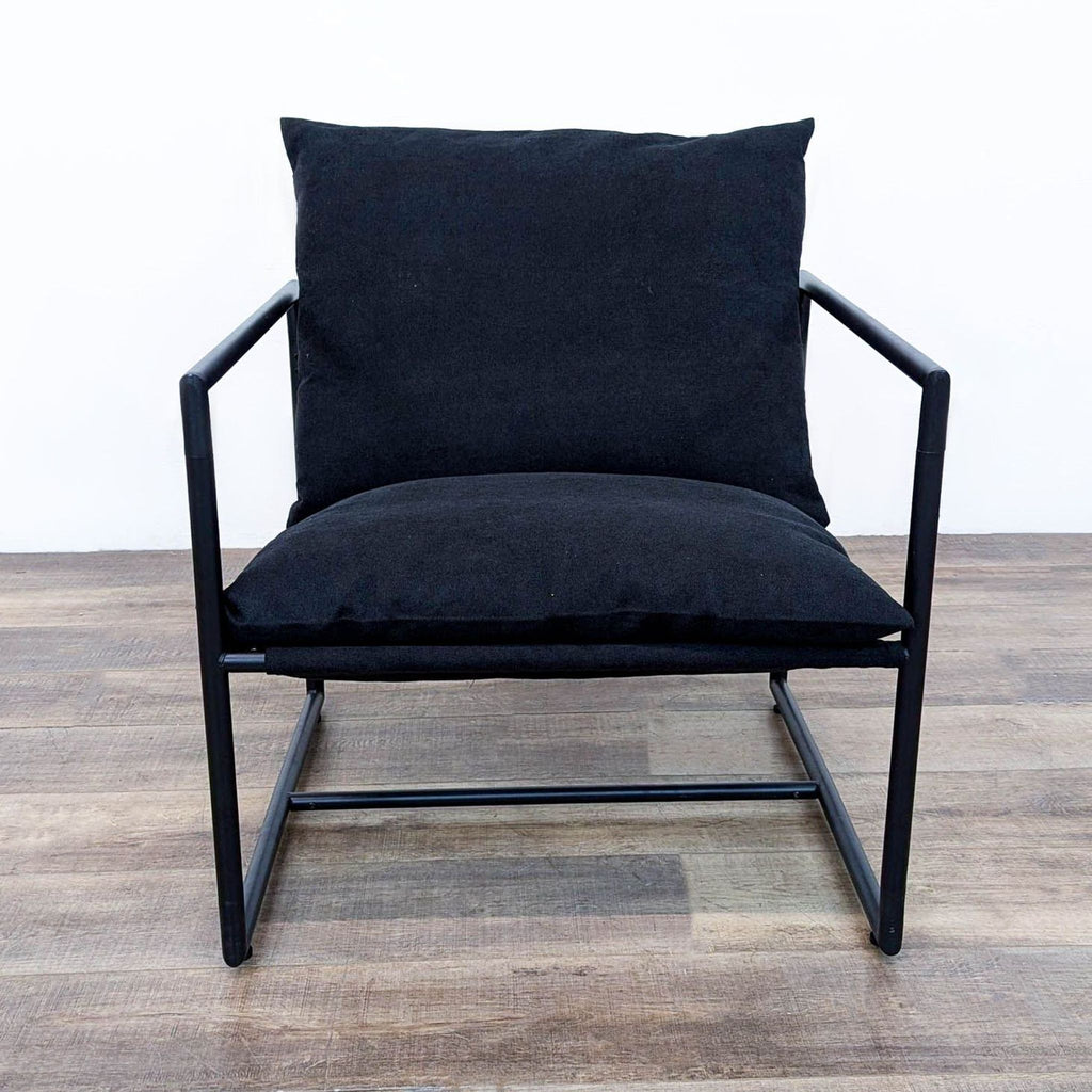 a black chair with a black leather seat 