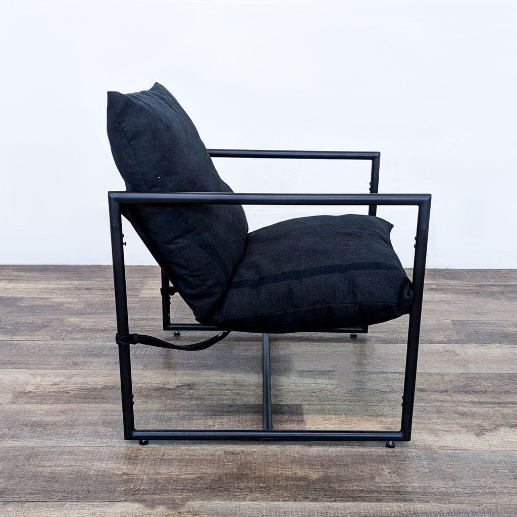 a black chair with a black leather seat 