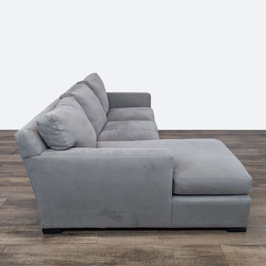 a couch with a black couch cushion and a black couch cushion 