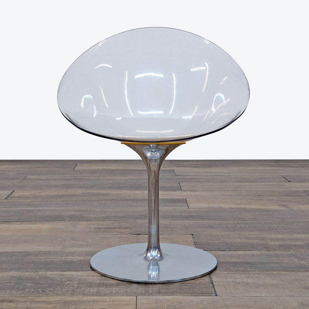 1. Kartell lounge chair with an egg-shaped clear shell and glossy aluminum rotating pedestal base, front view.