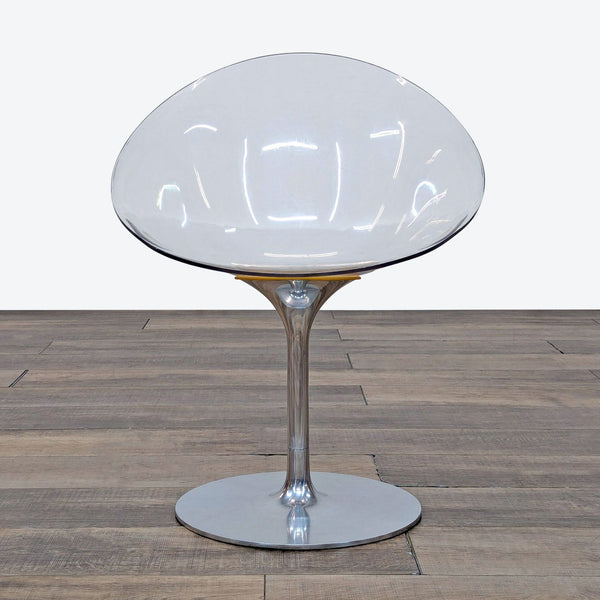 1. Kartell lounge chair with an egg-shaped clear shell and glossy aluminum rotating pedestal base, front view.