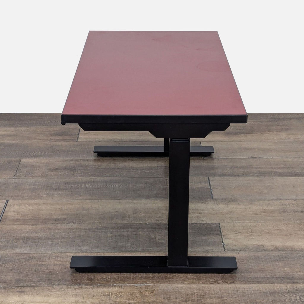 a table with a red chair and a blue chair 