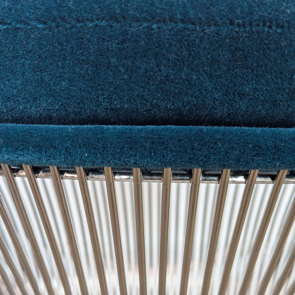 a blue blanket is hanging on a white wall 