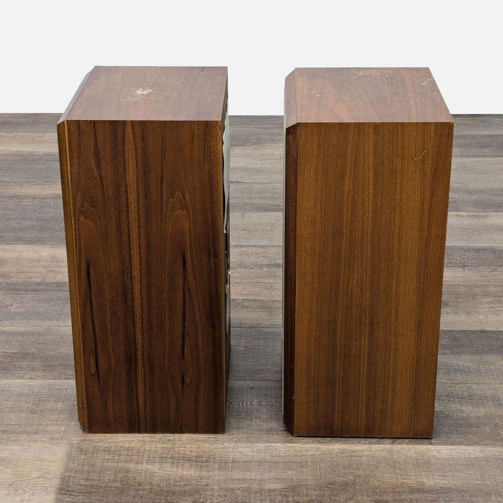 two wooden boxes on a wooden floor 