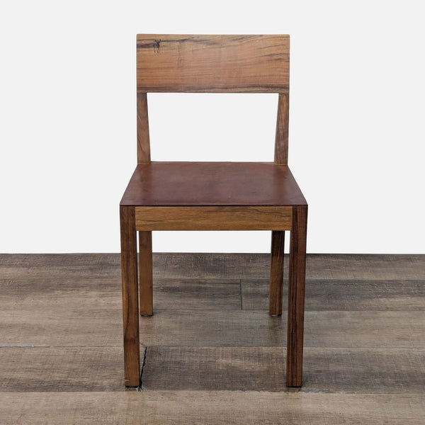 a wooden chair with a wooden seat on a floor 