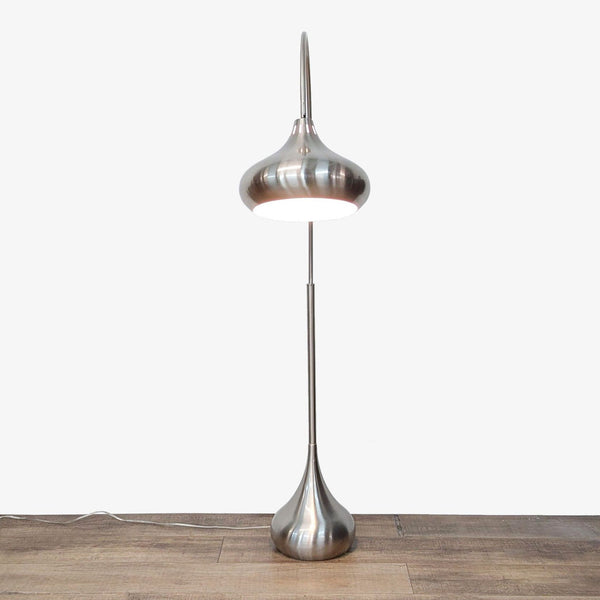 a lamp is lit up on a wooden surface 