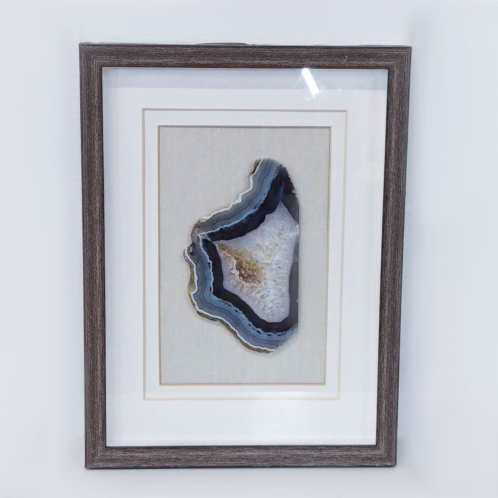 a painting of a white and black cat on a white wall 