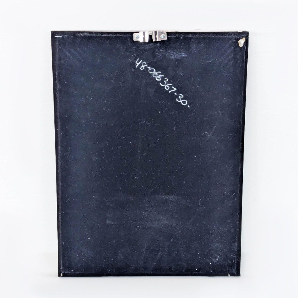 a black box with a piece of paper on top of it 