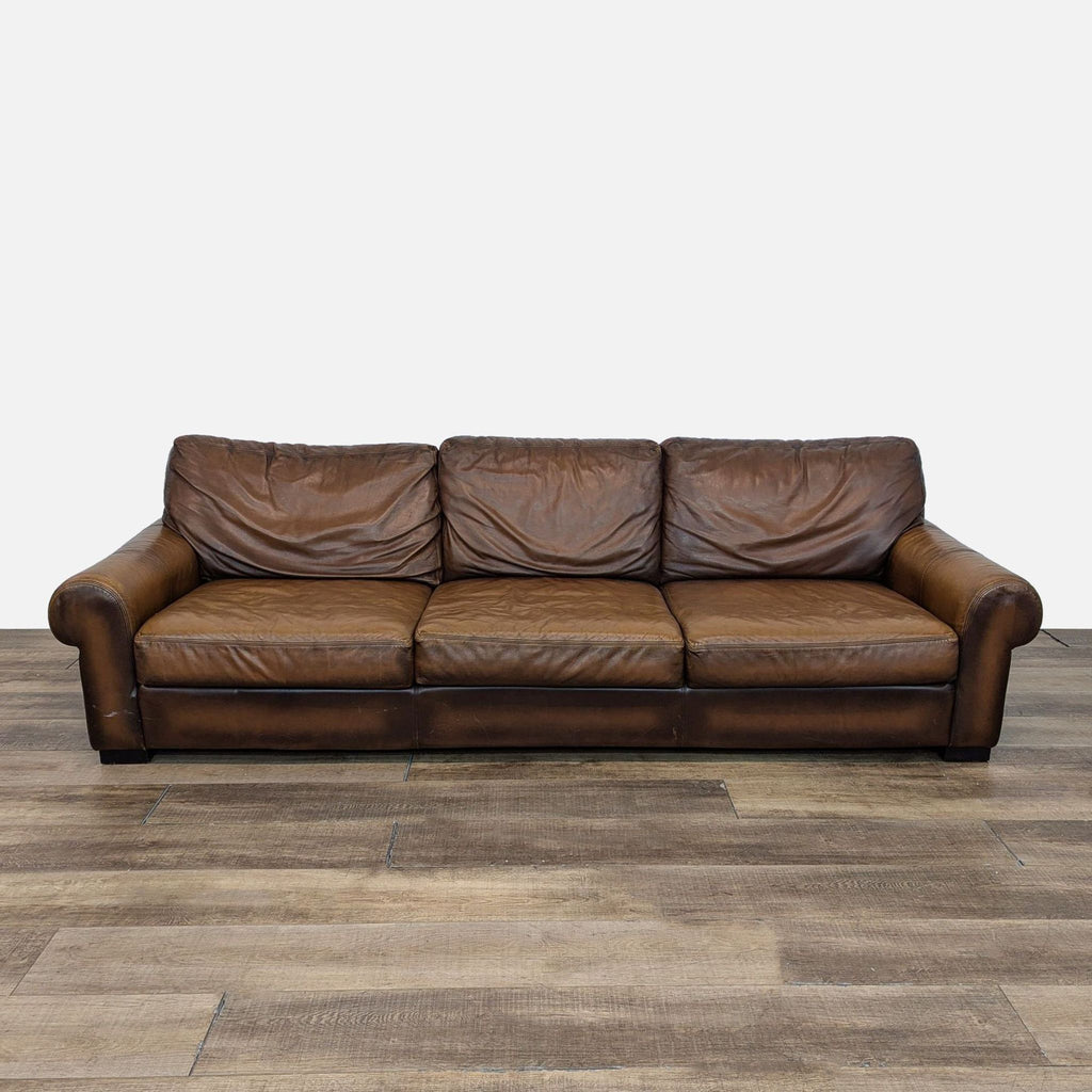 a couch with a brown leather couch cushion 