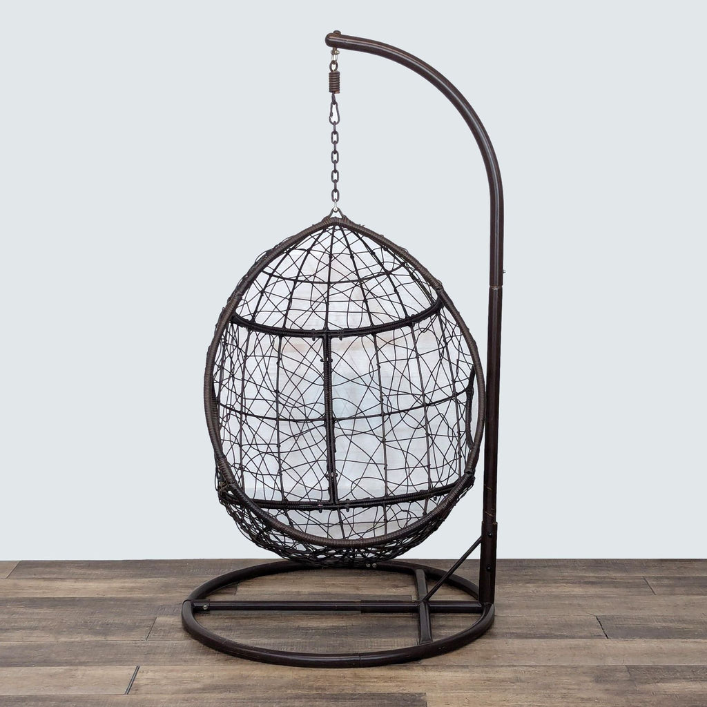 a bird cage with a bird shaped object in it 