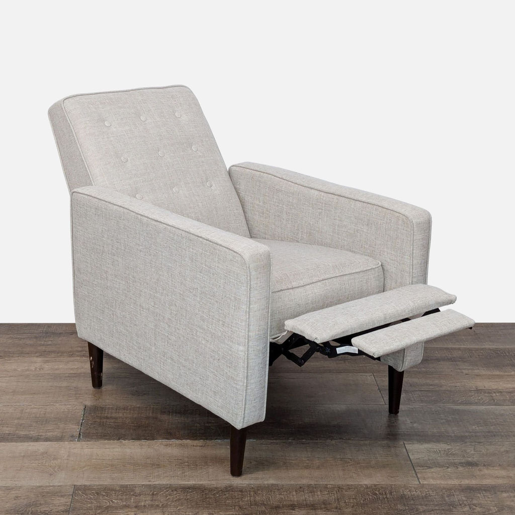 a white chair sitting on top of a wooden floor 