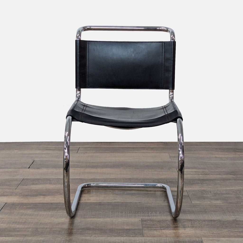 a chair with a black seat and a black chair 