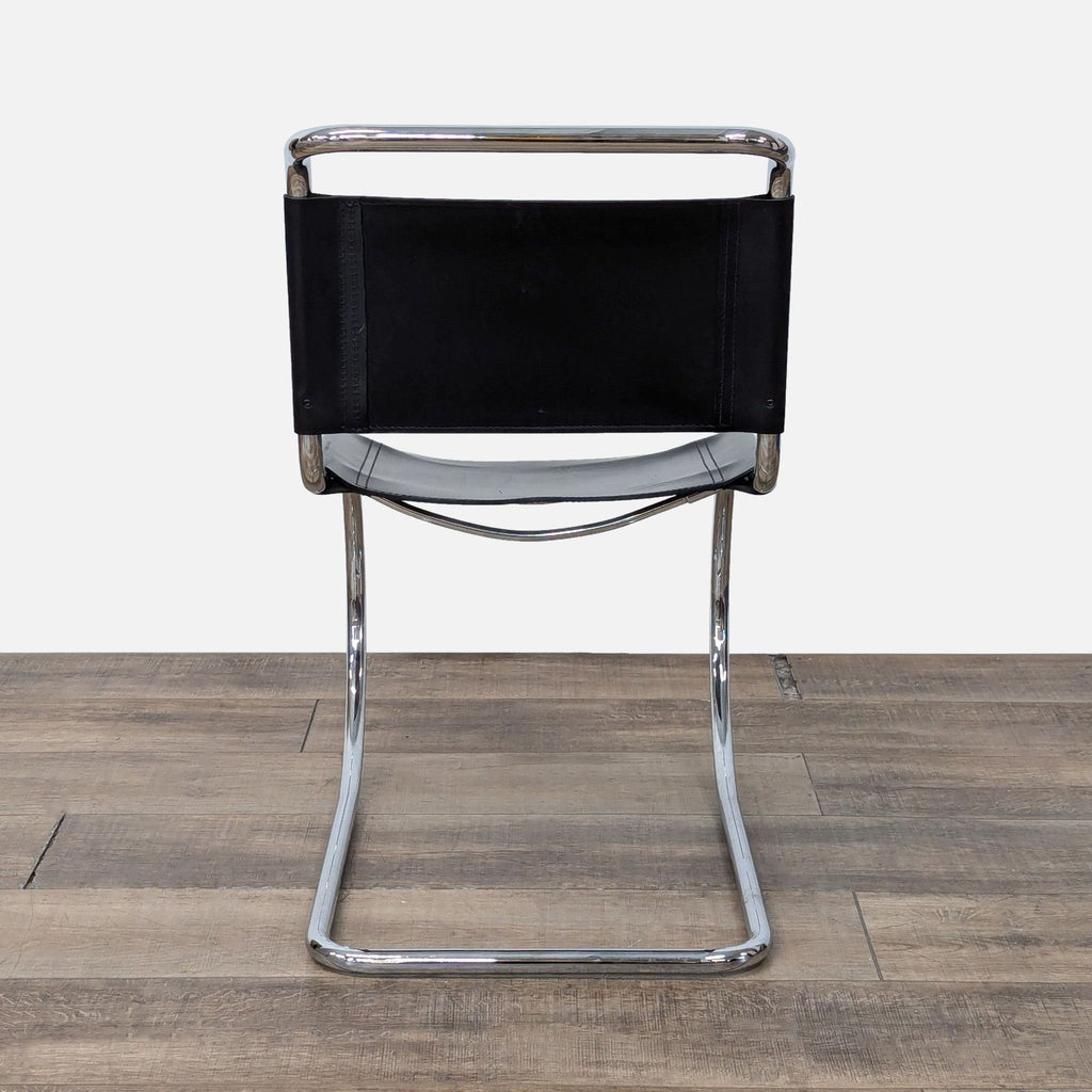 a chair with a black and white chair frame 