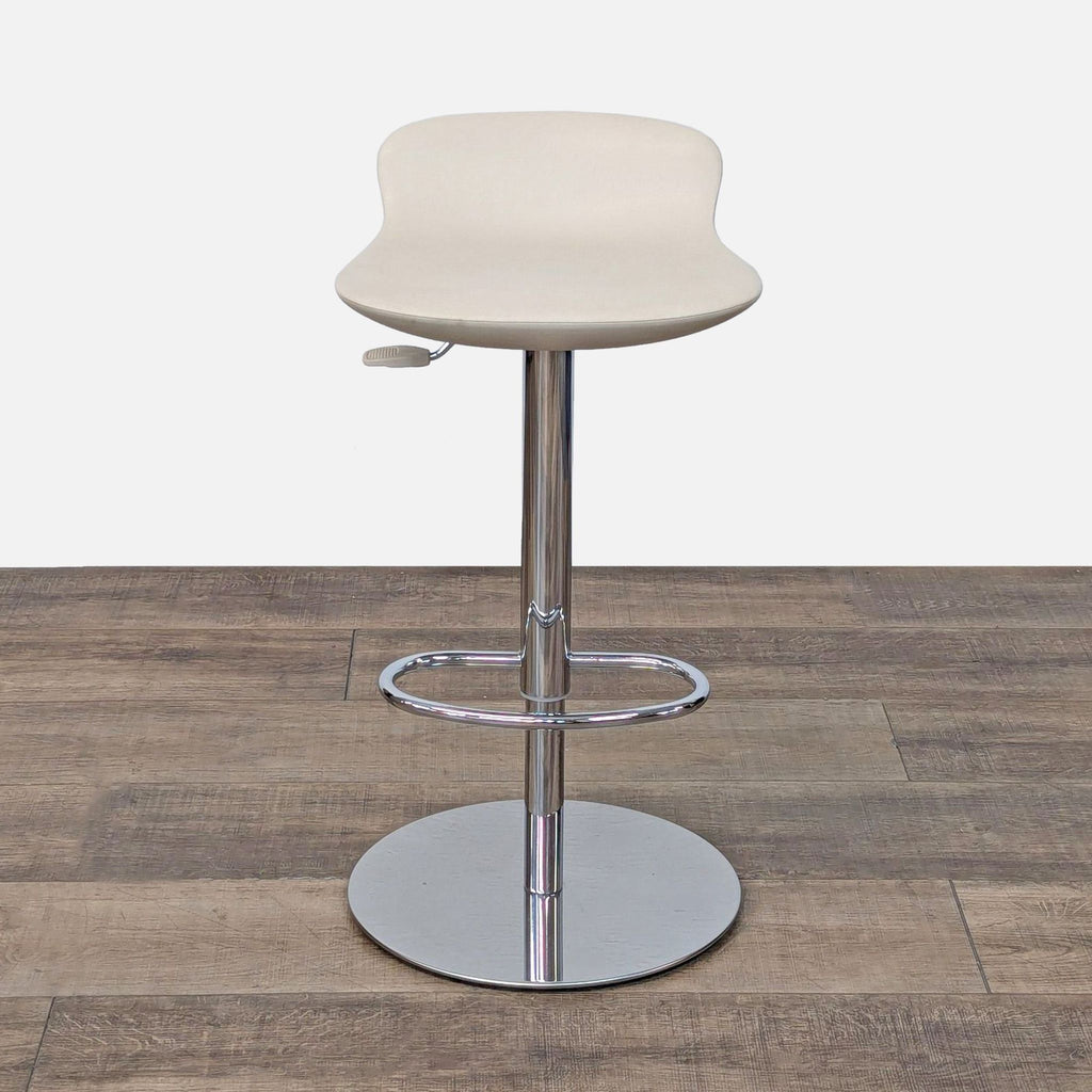 a white table topped with a white chair 