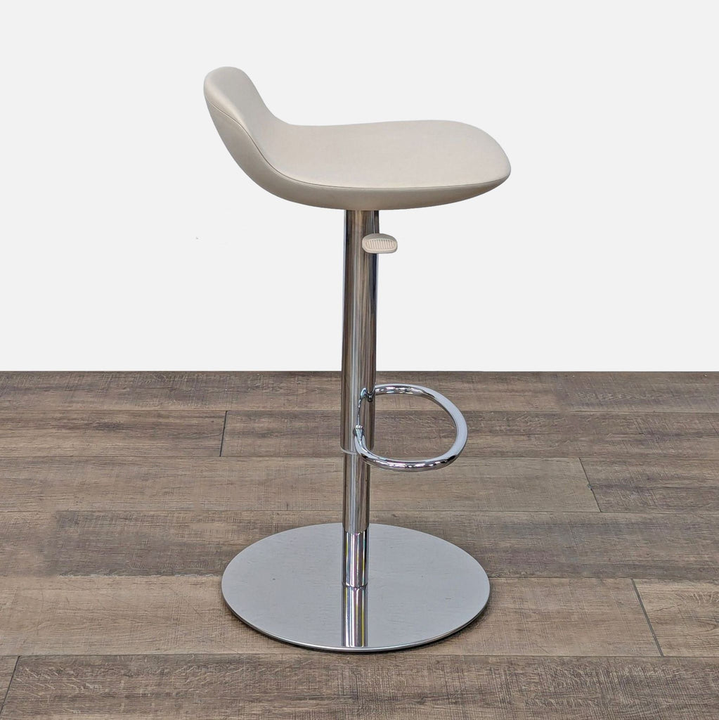 a white chair sitting on top of a wooden floor 