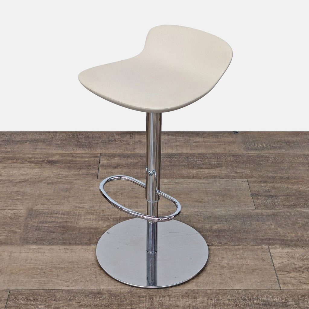 a wooden chair sitting on top of a wooden floor 