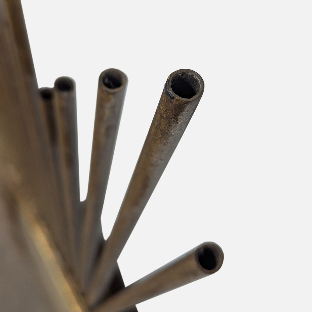 a metal object with a hammer on top of it 