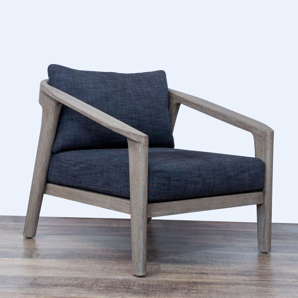 Malta lounge chair by Restoration Hardware, features weathered teak frame and woven wicker with cushioned seat and back.