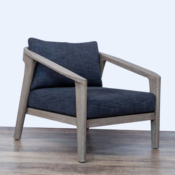 Malta lounge chair by Restoration Hardware, features weathered teak frame and woven wicker with cushioned seat and back.