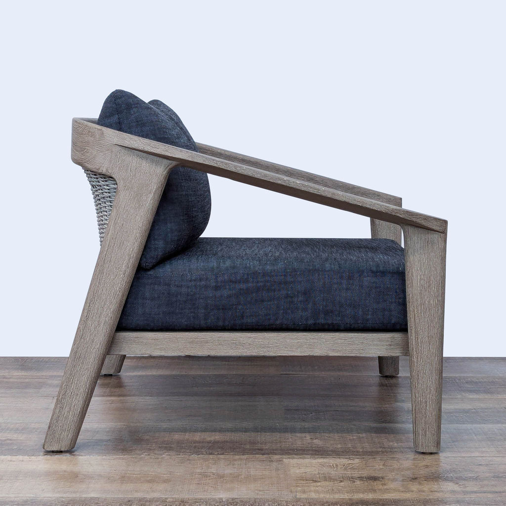 Outdoor Malta chair from Restoration Hardware, showcasing premium teak, all-weather wicker, and upholstered quick-dry cushions.