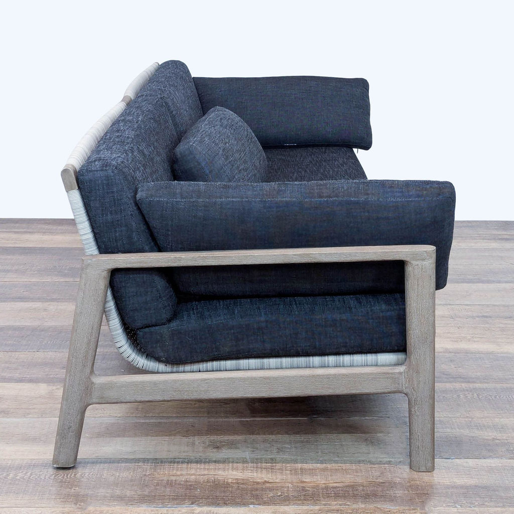 Restoration Hardware Mesa sofa in weathered teak, all-weather wicker back, and plush quick-dry upholstery.  