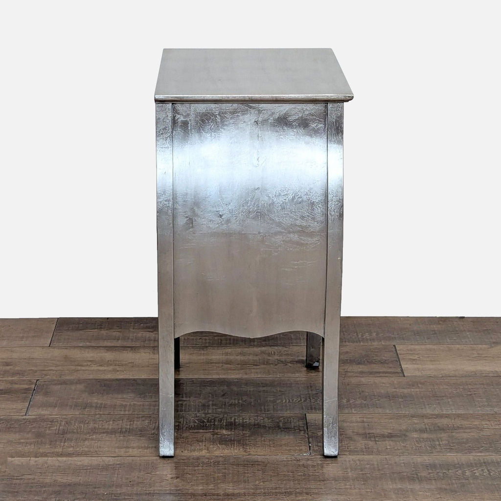 a white refrigerator sitting on top of a wooden floor 