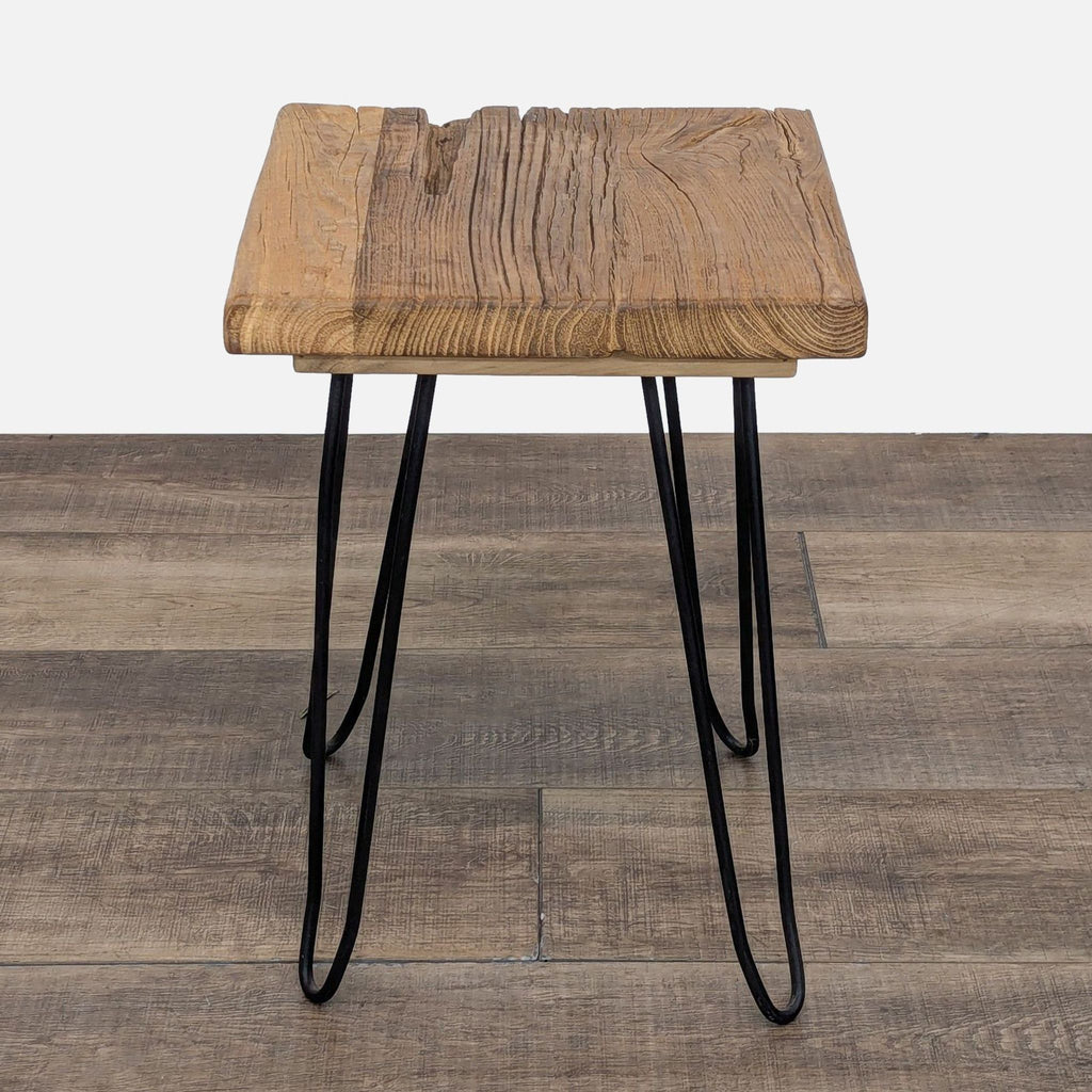 a wooden chair with a wooden handle on it 