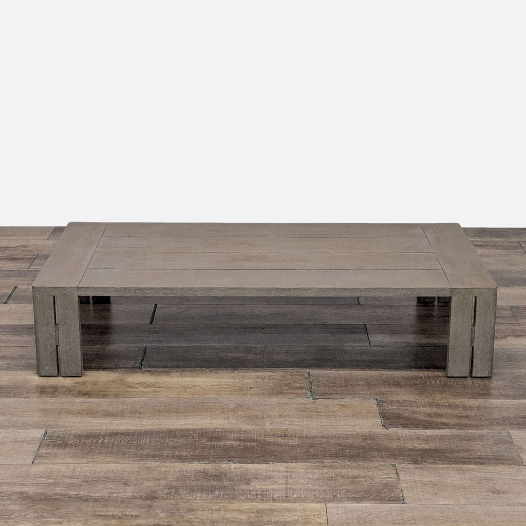 3. Low-profile Reperch Matira teak coffee table, showcasing split-plane legs and a subtle aperture detail for outdoors.