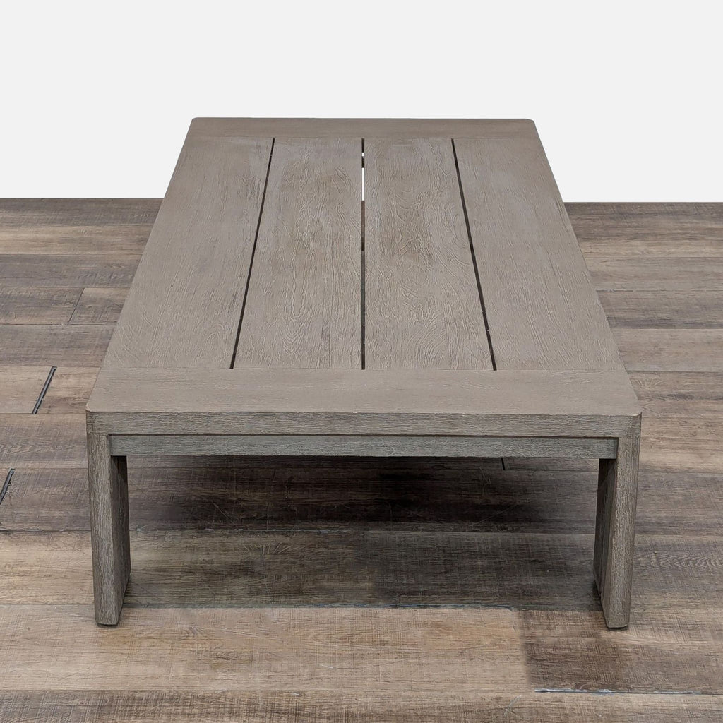 2. Contemporary rectangular coffee table by Reperch, featuring weathered teak wood and a slender open-leg design.