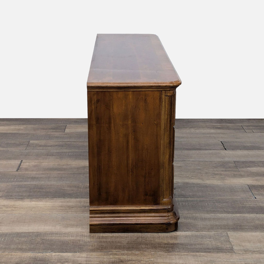 a wooden bench sitting on top of a floor 