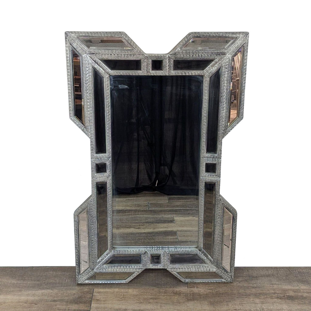 1. Reperch mirror with a unique geometrically-shaped carved and silvered frame featuring beveled glass inserts.