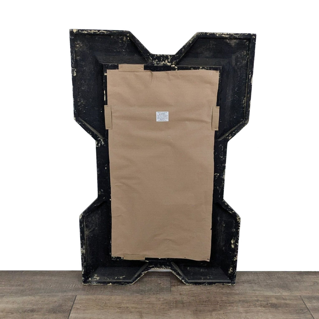 2. Rear view of the Reperch mirror showcases its backing and distinctive angular frame shape.