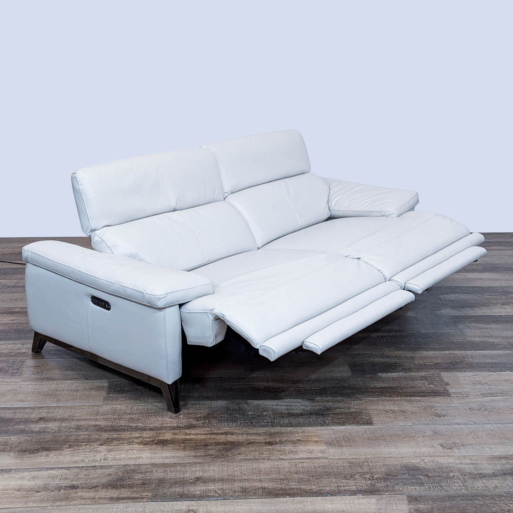 Scandinavian Designs Voss loveseat features leather, power recline, USB charging, headrests, and chrome accents.