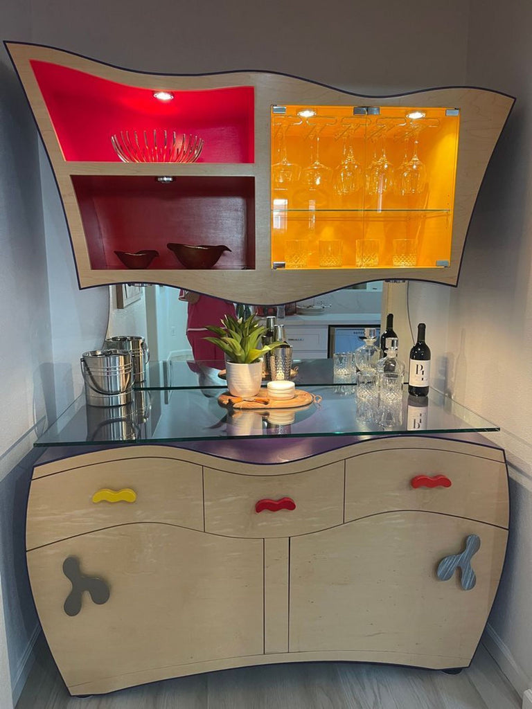 Custom maple buffet cabinet set featuring illuminated top shelves, glass doors, and storage; one knob missing.